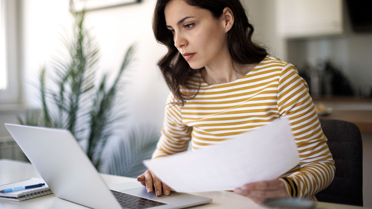 Woman looking at laptop